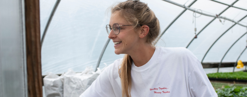 Image of Avery in the greenhouse