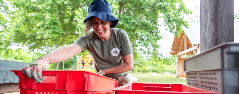 image of Allison Aley delivering harvest baskets