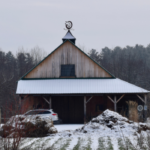The snow-covered farm in winter