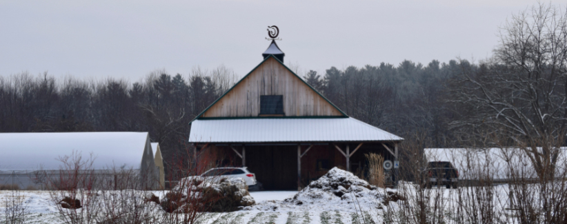 The snow-covered farm in winter